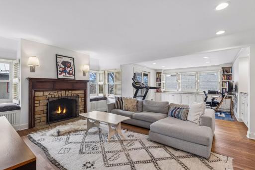 The primary suite adjoins an upper level family room and office space with a screened-in balcony.