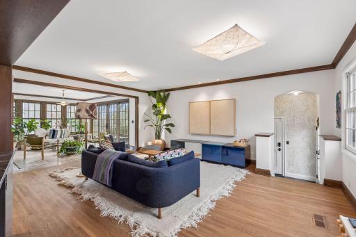 Main level family room adjacent to the kitchen and sunroom. A hall off of the family room includes a spacious mudroom, powder room, side entrance, and access to the 2.5 car attached garage.