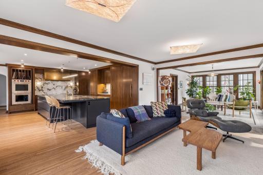 The heart of the home offers a high level of form and function with a generous chef's kitchen open to the family room and sun room. French doors lead to the yard and patio from the sunroom.