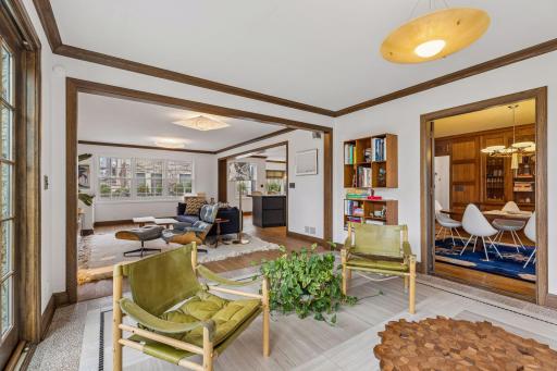 Main level sunroom and family room. French doors lead into the formal dining room.