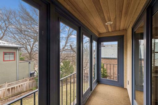 Upper level screened-in balcony. Seasonal views of Lake of the Isles.