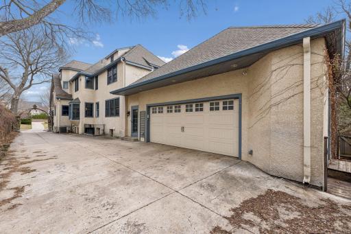 Private driveway and attached 2.5 car garage. The adjacent side door leads to the mudroom. Newer roof on the home and garage.