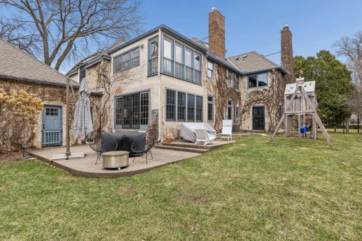 The double lot offers a large and private fenced-in yard and patio area. Sliding French doors from the sunroom provide convenient access to the outdoors.