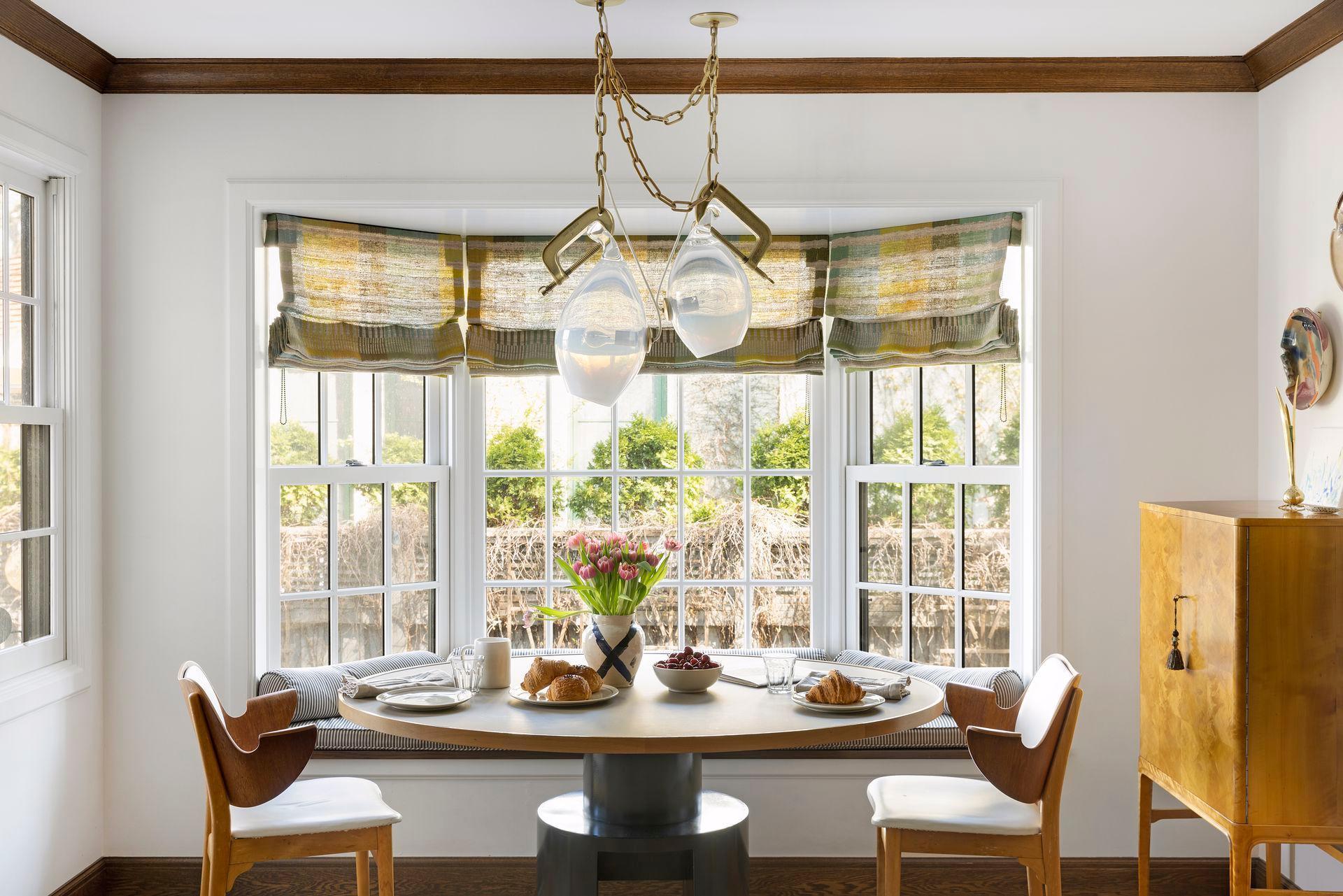 Informal kitchen dining with built-in window seat.