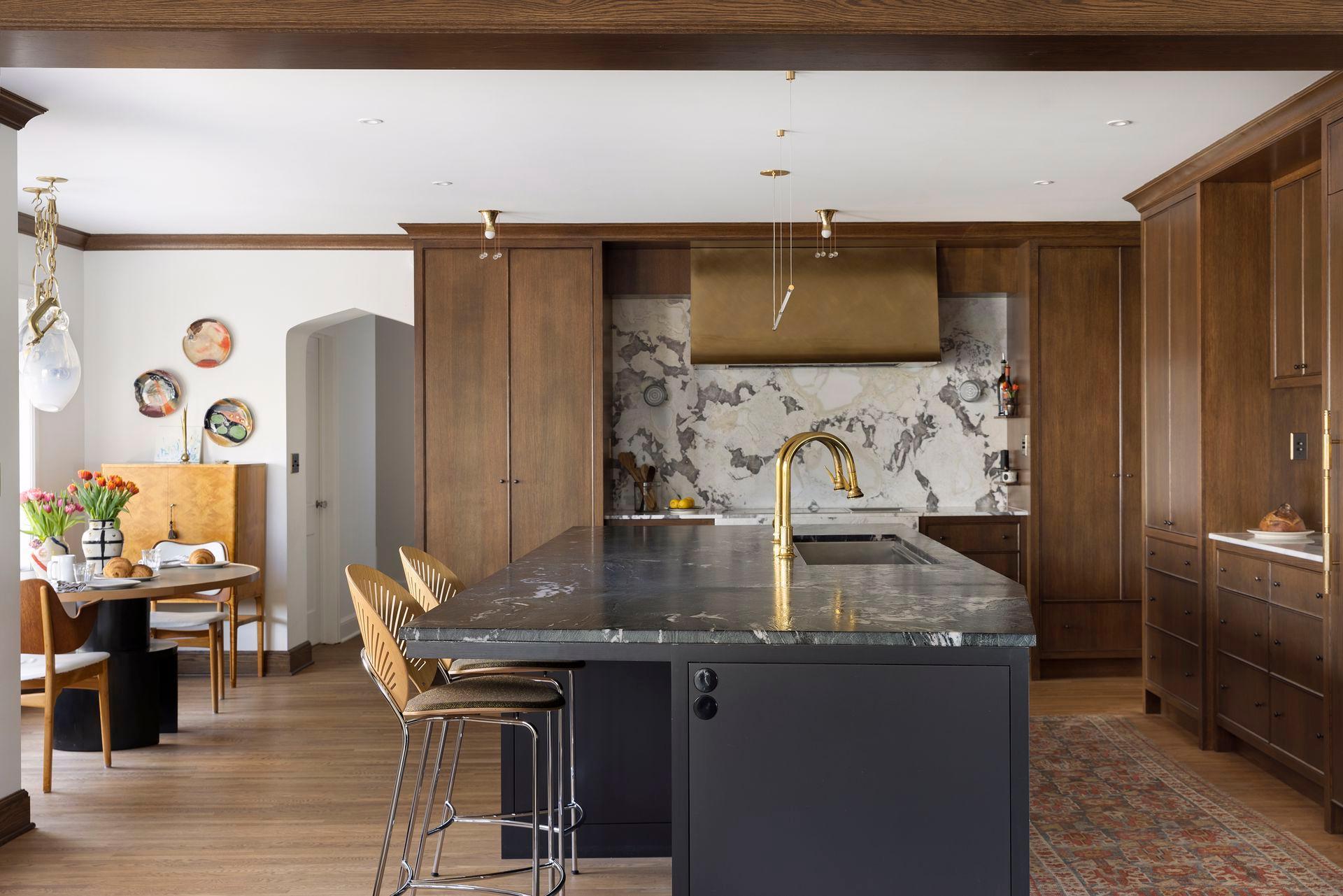 The heart of the home offers a high level of form and function with a generous chef's kitchen open to the family room and sun room.