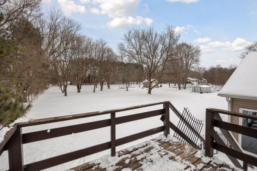 Large deck off dining/kitchen overlooks lovely 2.5 acres