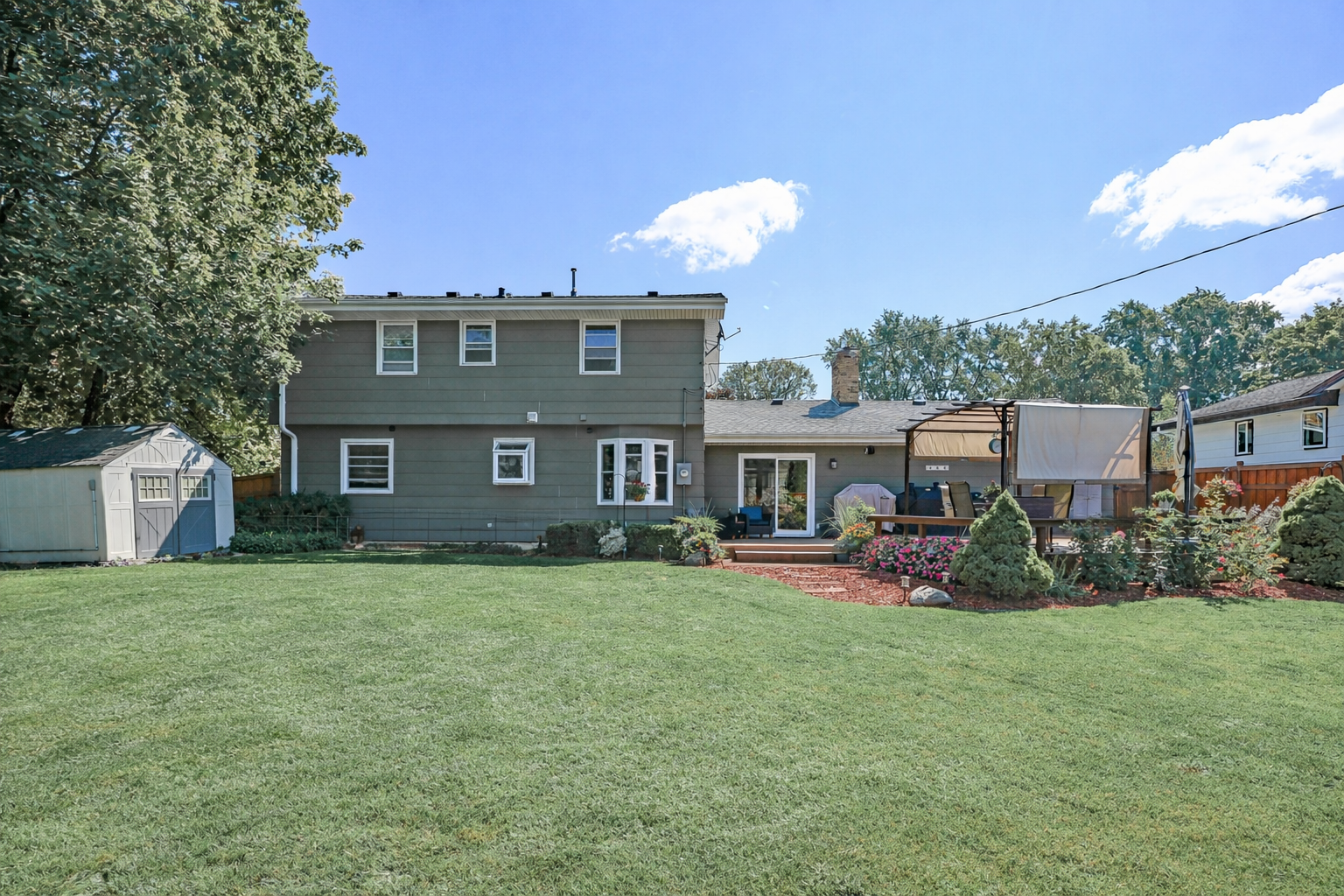 Total privacy. The fully fenced backyard is a secluded sanctuary of lush greenery and peace.
