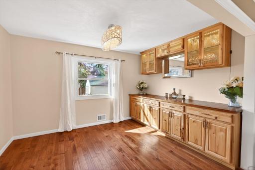Sophisticated flow. The formal dining room with its new built-in hutch complements the casual eat-in kitchen area.