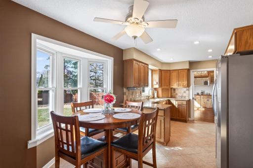 The heart of daily life. The informal dining area flows effortlessly from the kitchen, offering a sun-filled spot to gather.