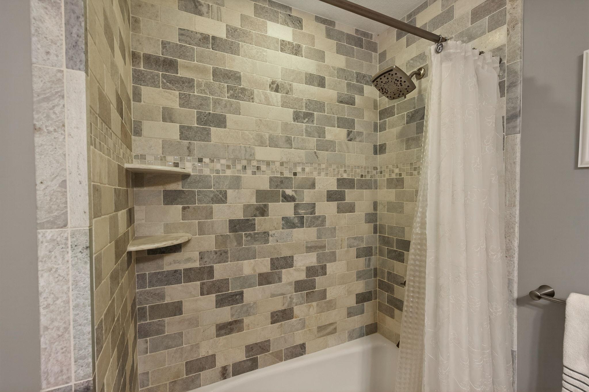 Gorgeous tile in upper level full bath.