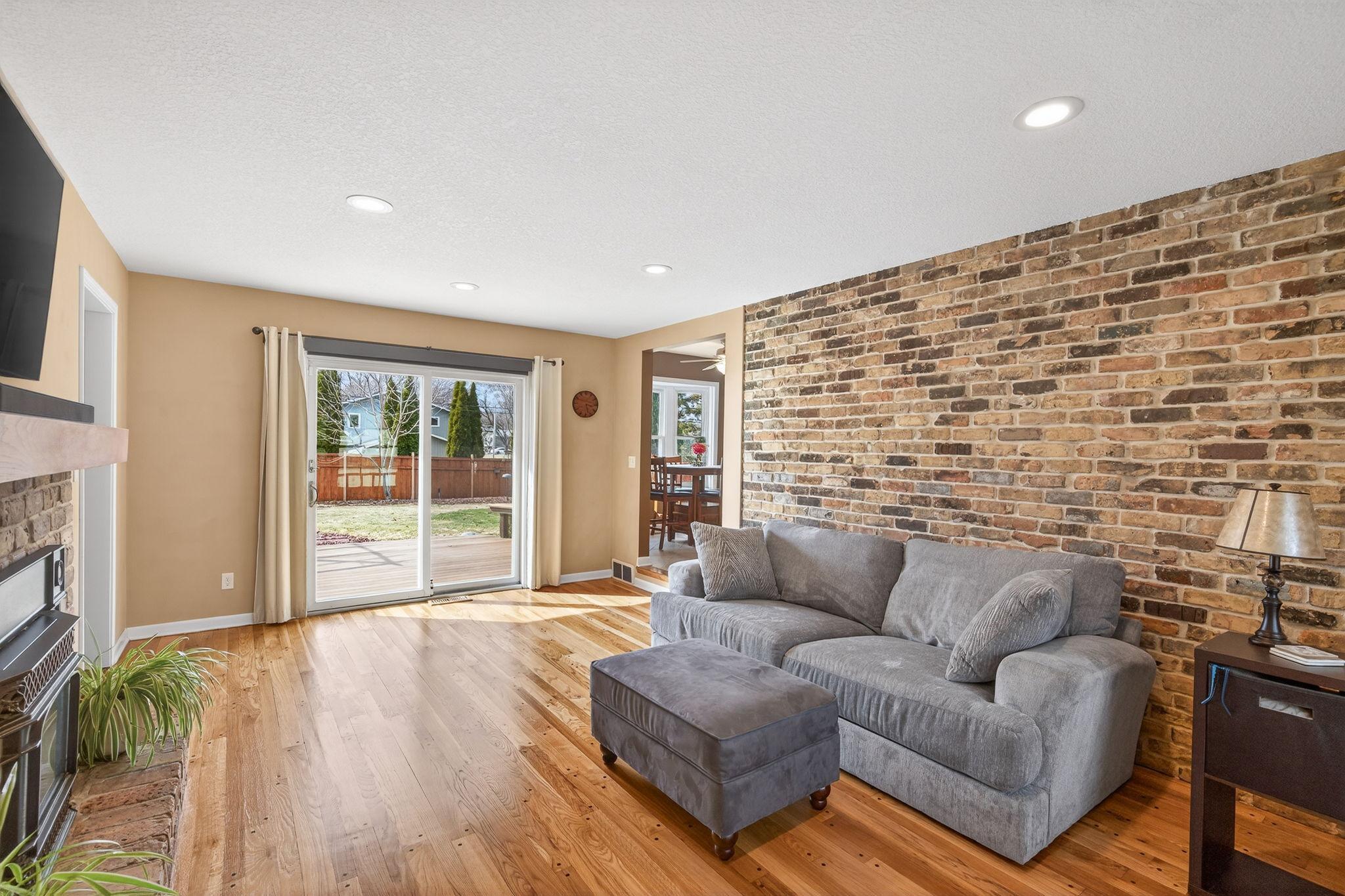 Seamless indoor-outdoor living. Step out from the family room to a private deck overlooking the manicured grounds