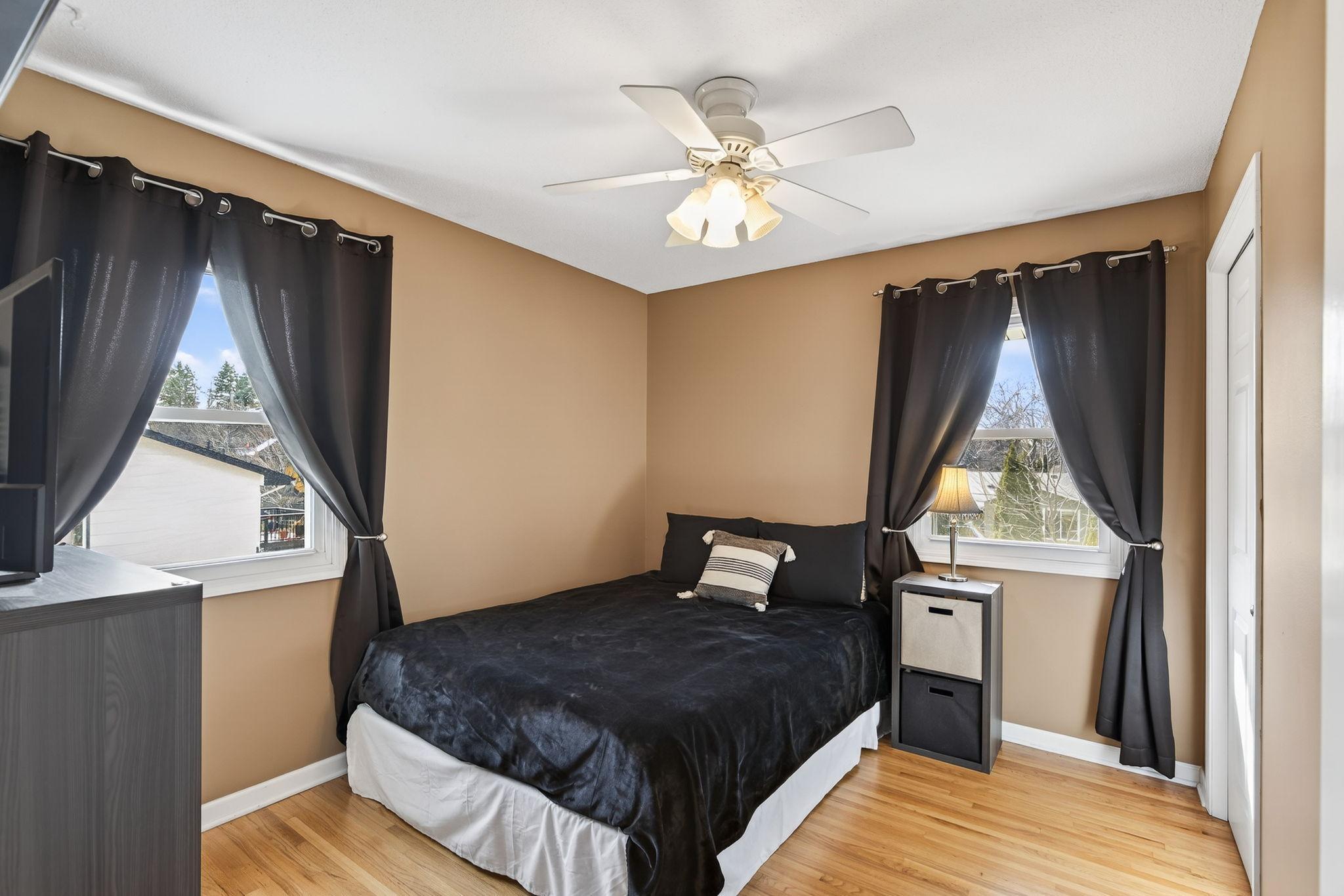 Comfort and character. This generously sized bedroom features neutral tones, an oversized closet, and easy access to the full hallway bathroom.