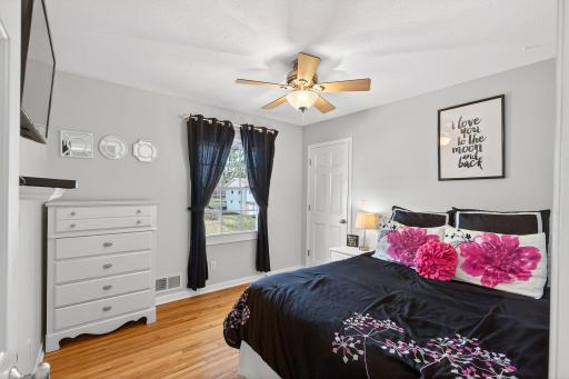 Consistency in quality. The second guest bedroom boasts beautiful hardwood floors and a surprisingly deep closet, offering plenty of room for a growing family or guests.