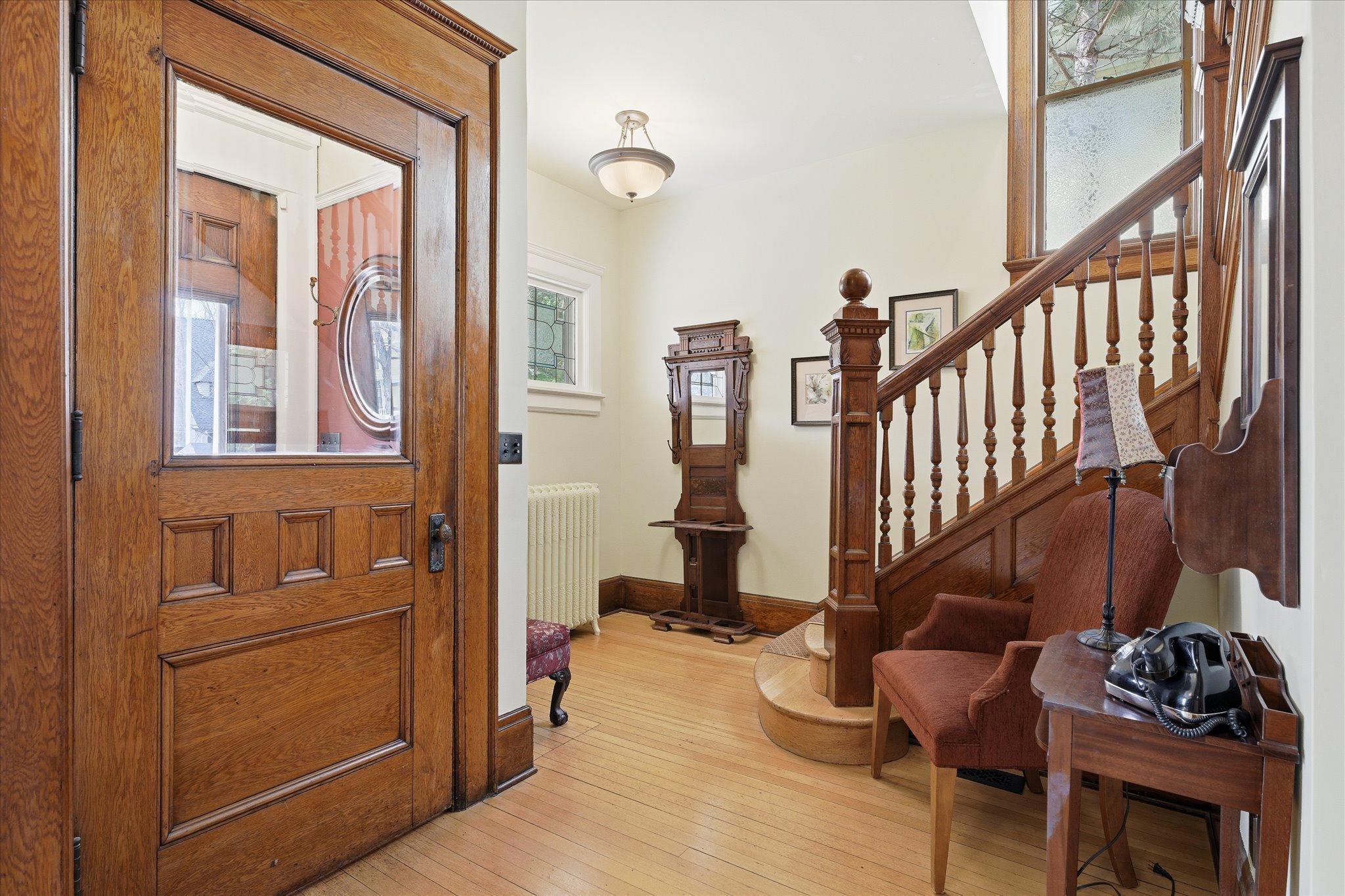 Grand foyer with stunning original woodwork