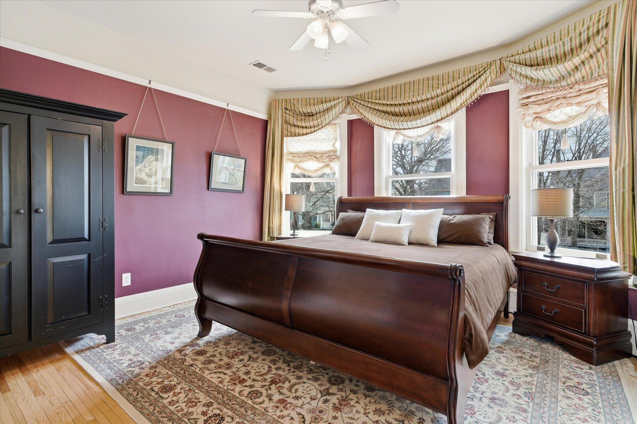 Primary suite gets lots of light with bay windows