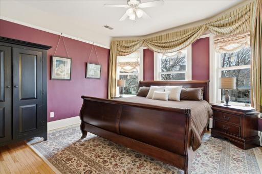 Primary suite gets lots of light with bay windows