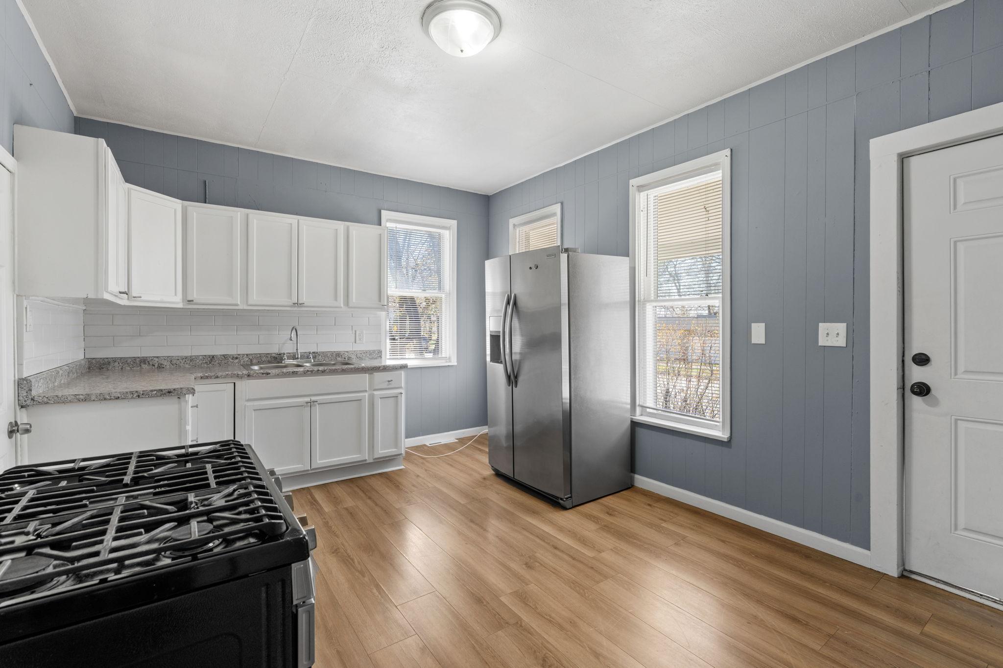 Kitchen has room to add your own storage shelving
