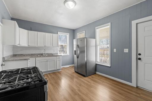 Kitchen has room to add your own storage shelving