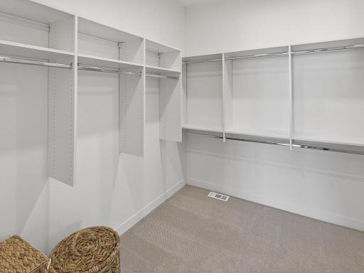 Primary Bedroom WIC with custom shelving system
