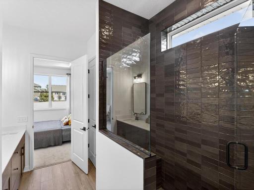 Primary Bath - Tile Shower with built in Bench, glass panel and pivot door