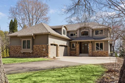 A thoughtfully designed six-bedroom, five-bath residence with a five-car garage, offering expansive living spaces, a seamless open layout, and multiple spaces tailored for work, relaxation and entertaining.