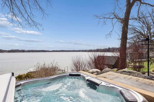 The hot tub offers a quiet place to unwind with views of the lake.