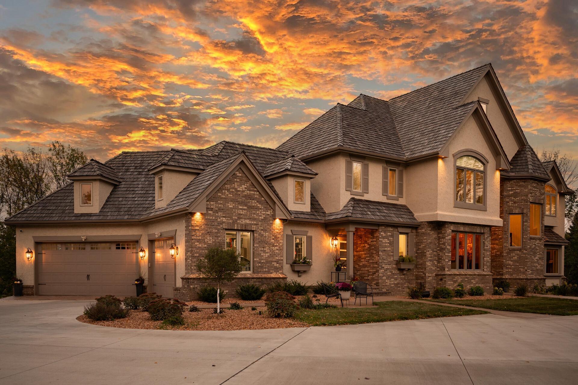 Another view of the stunning front exterior, showcasing the spacious three-car garage.
