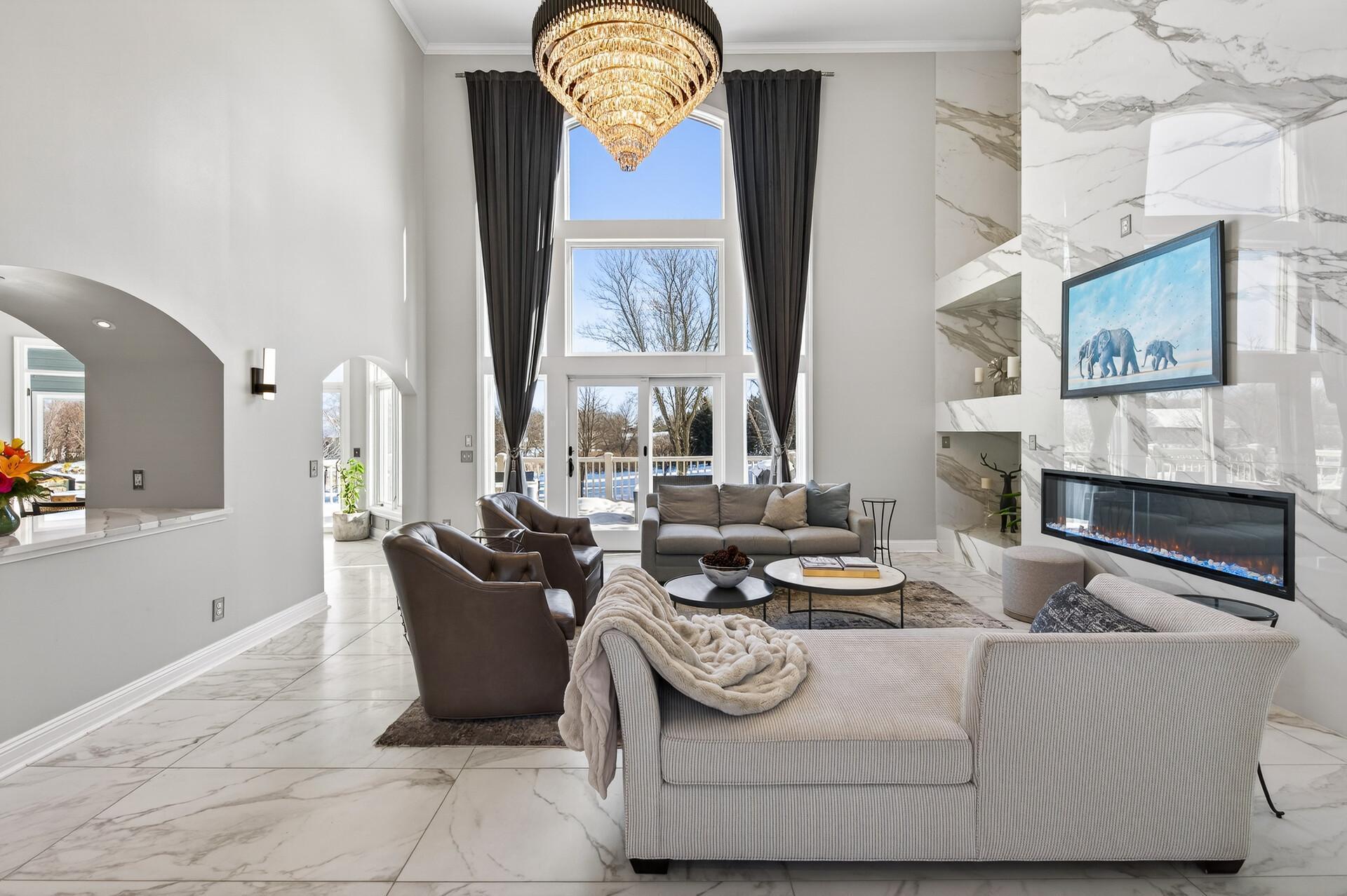 An impressive view featuring the expansive floor-to-ceiling windows that bathe the space in natural light.