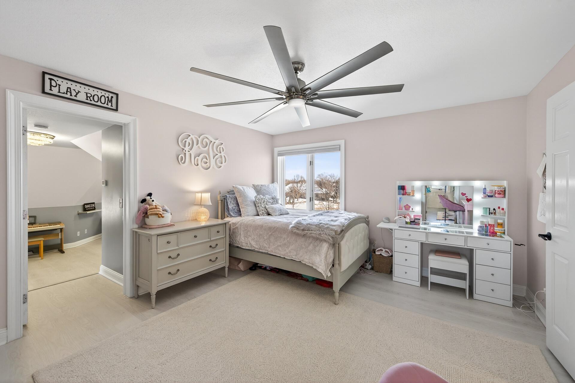 Bedroom three is generously sized with luxury plank flooring and a large closet, and it offers private access to the expansive bonus room.