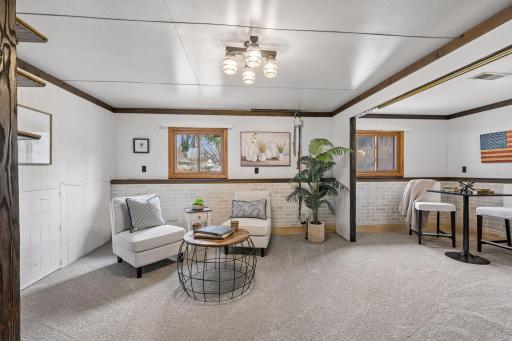 Retreat downstairs for entertaining, exercise or hobby room!