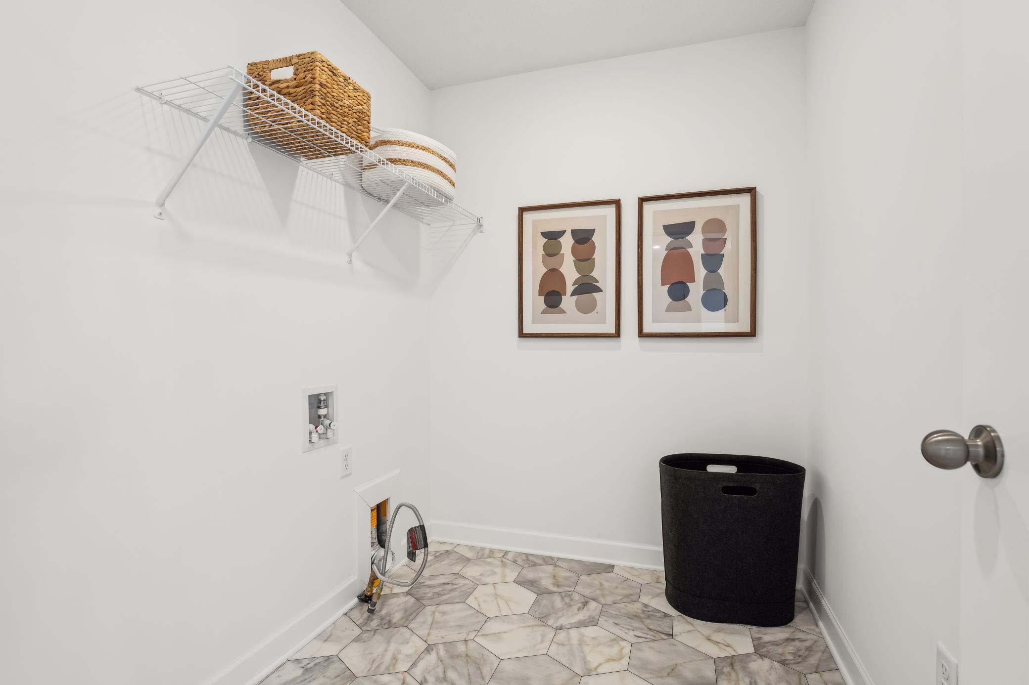 (Photos of model home, features will vary) The laundry room will simplify chore days with an overhead shelf and washer-dryer connections.