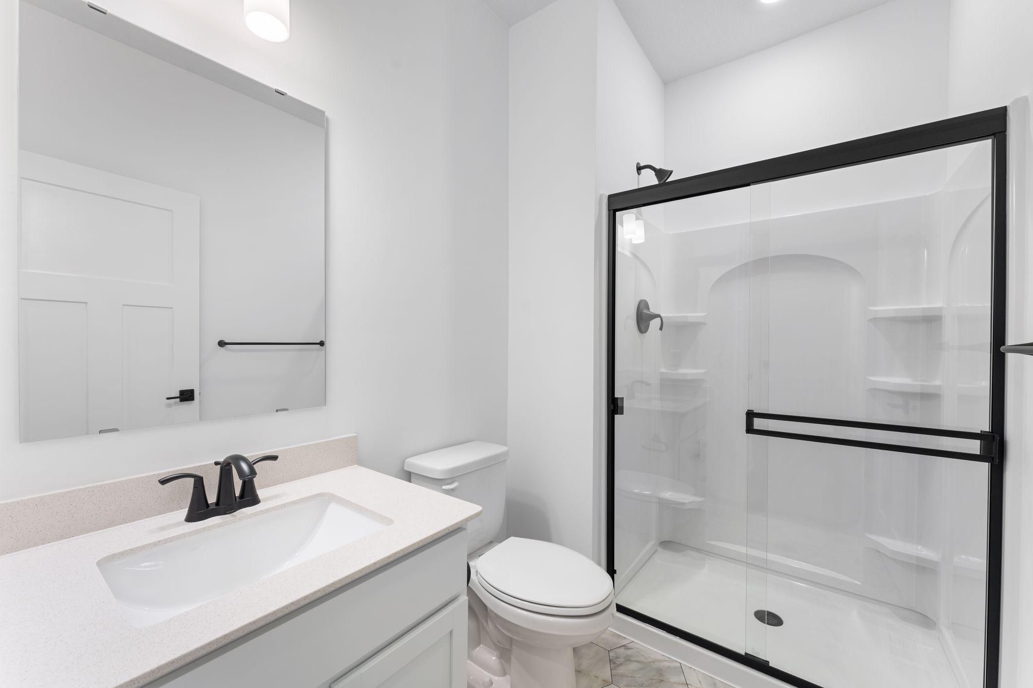 (Photos of similar home, features will vary) This 3/4 bath is located just across from the guest suite, providing the utmost privacy for any visitors staying the night!