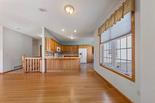 Additional dining area featuring a large window overlooking the front yard, filling the home with abundant natural light.