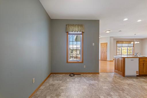 Cozy breakfast nook with a window overlooking the yard, perfect for casual dining and morning coffee.