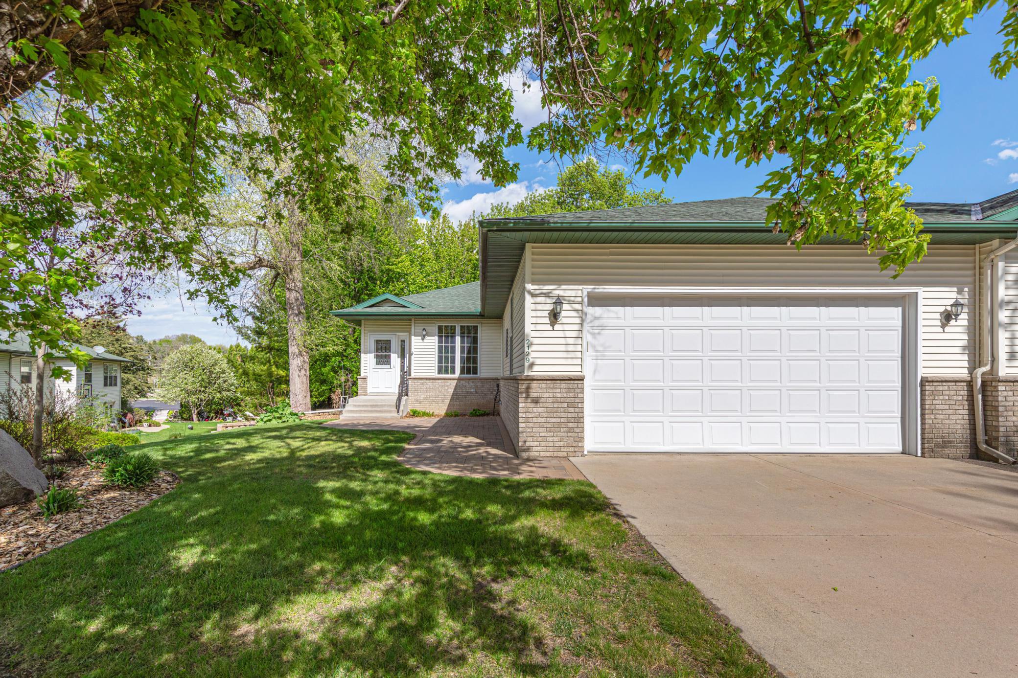 Nice cement driveway leading to the two car attached garage