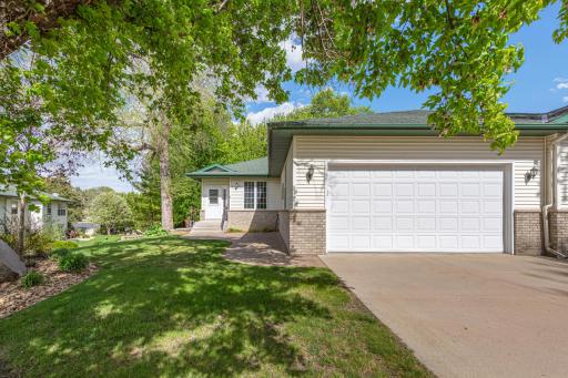 Nice cement driveway leading to the two car attached garage