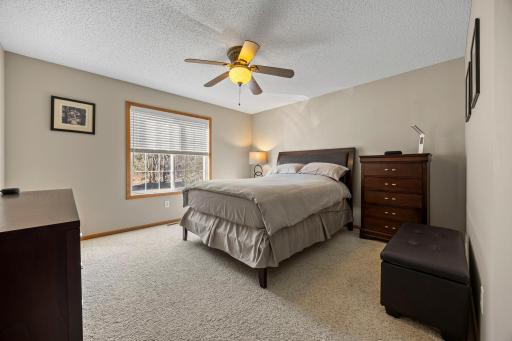 The primary bedroom includes a large walk-in closet with wire shelving for ample storage.