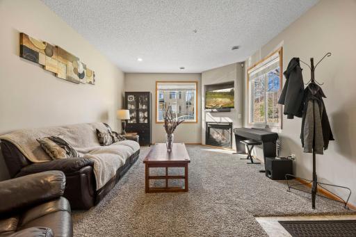 The welcoming main level features 9-foot ceilings and an abundance of windows, creating a warm and inviting atmosphere.