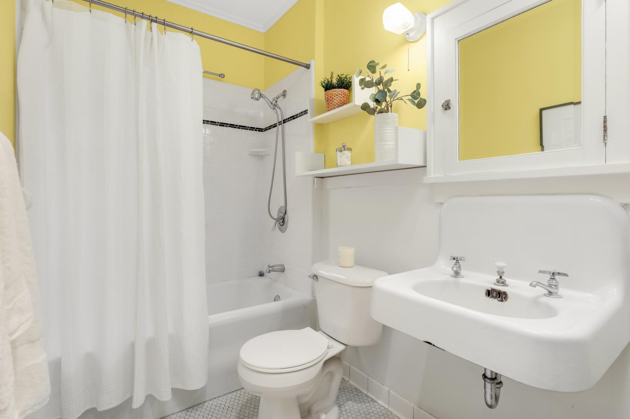Bright and charming bathroom with good storage