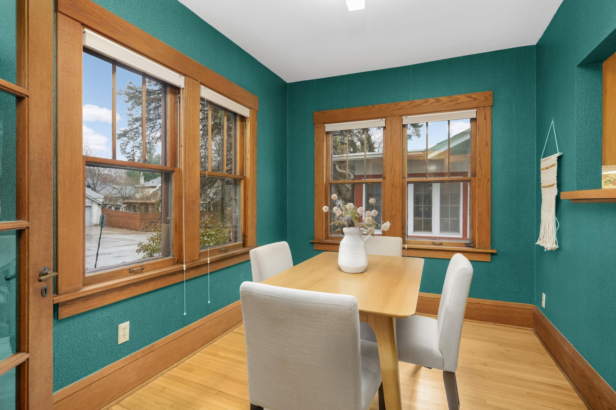 Dining room sits along the front of the house and enjoys lots of natural light