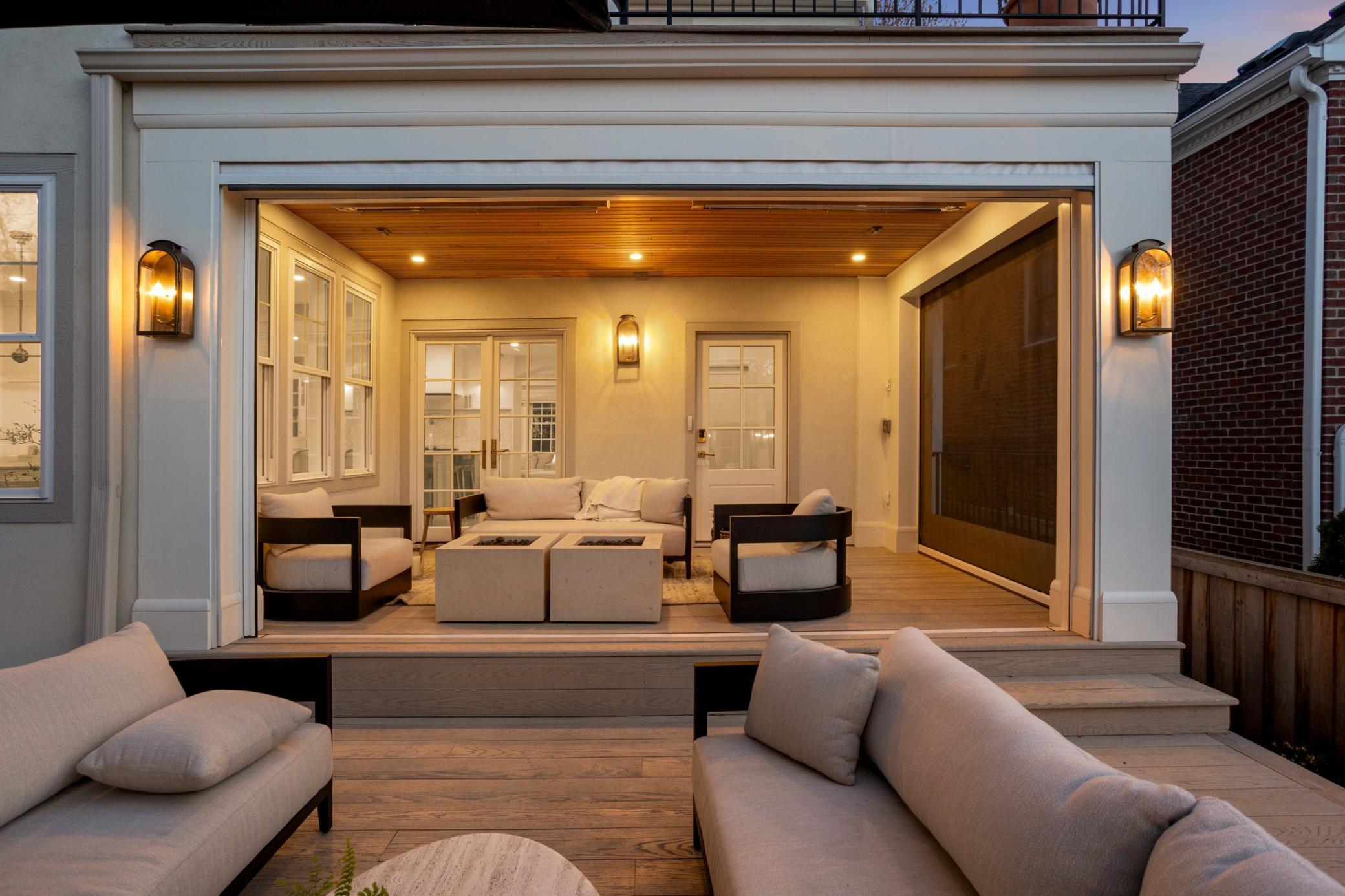 Covered back deck with custom phantom screen and vinyl surround for (nearly) year round use