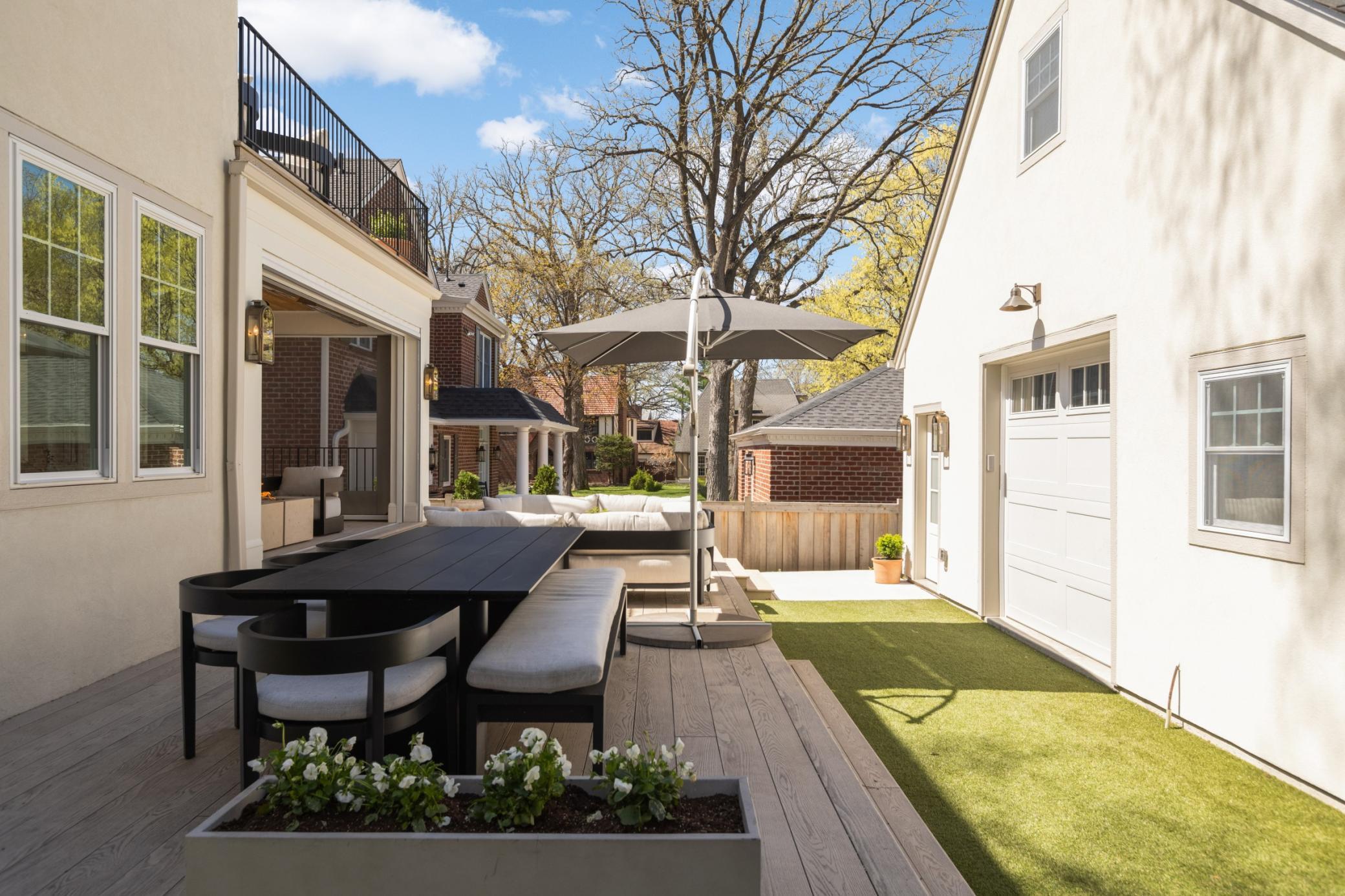 New wood privacy fence, New stone retaining wall, New concrete sidewalks