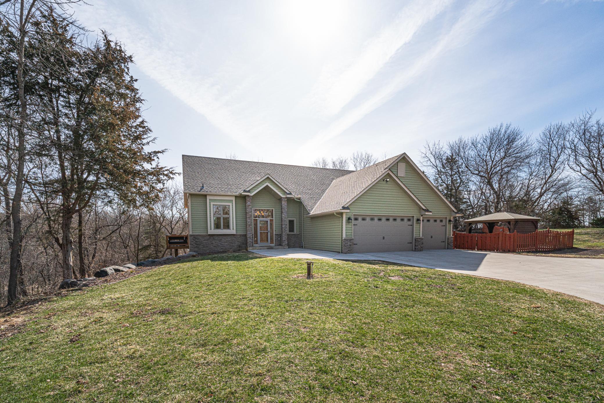 The home is surrounded by mature trees and has numerous places to walk, go sledding, and more!