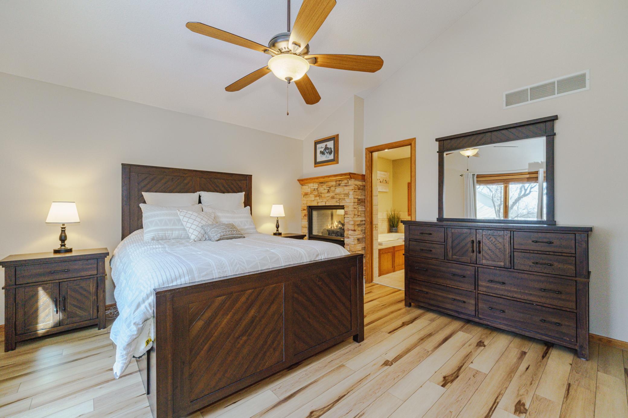View of the primary suite looking towards the private bathroom.