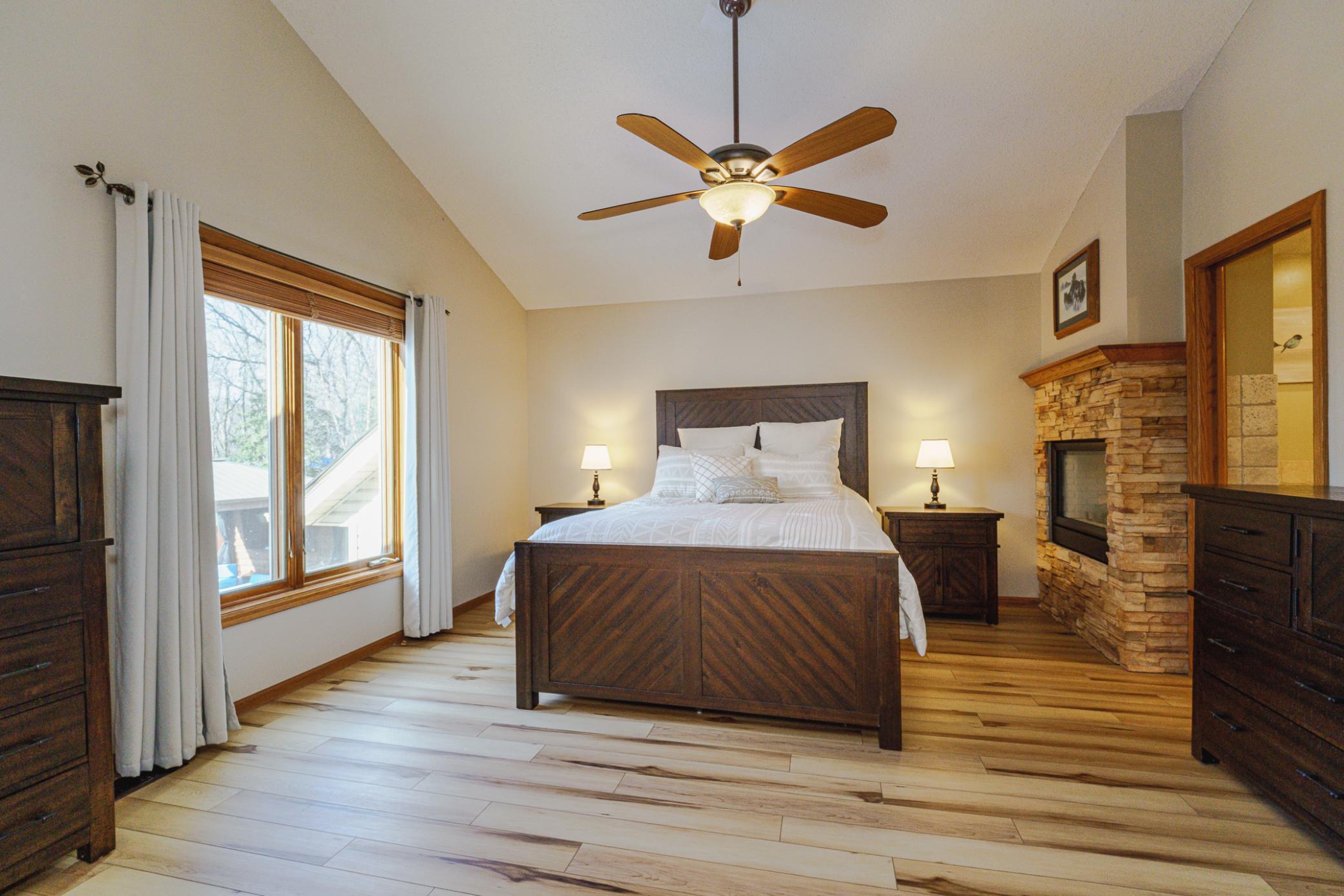 The sizeable owner’s suite was formerly two bedrooms, converted into one large space. One of three fireplaces in the home is in this space.