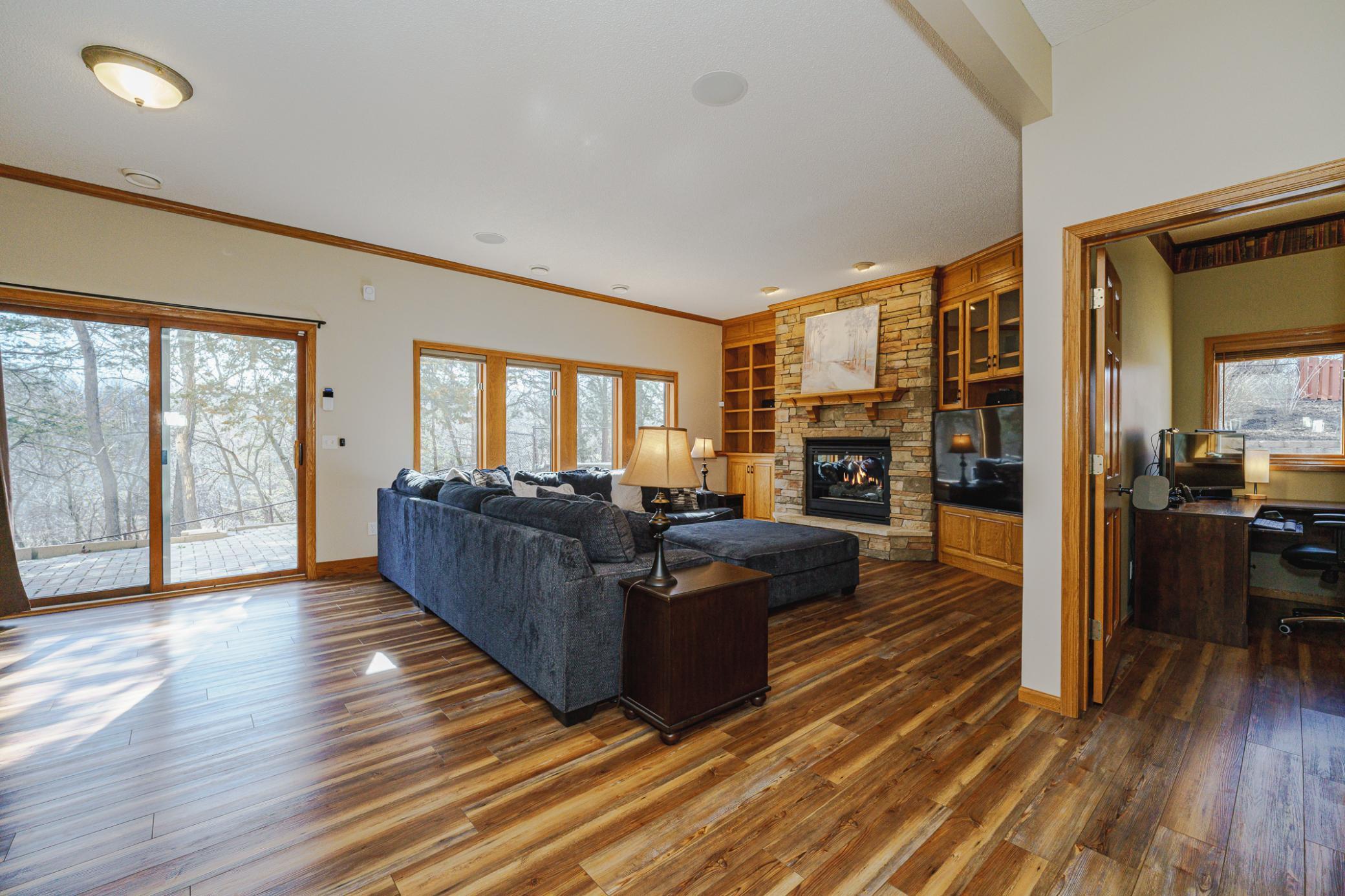 There are TWO finished WALKOUT lower levels with bright, full-sized daylight windows. The first lower level has a beautiful family room with 9 1/2-foot ceilings with crown molding, and a gas fireplace with stone surround flanked by built ins.