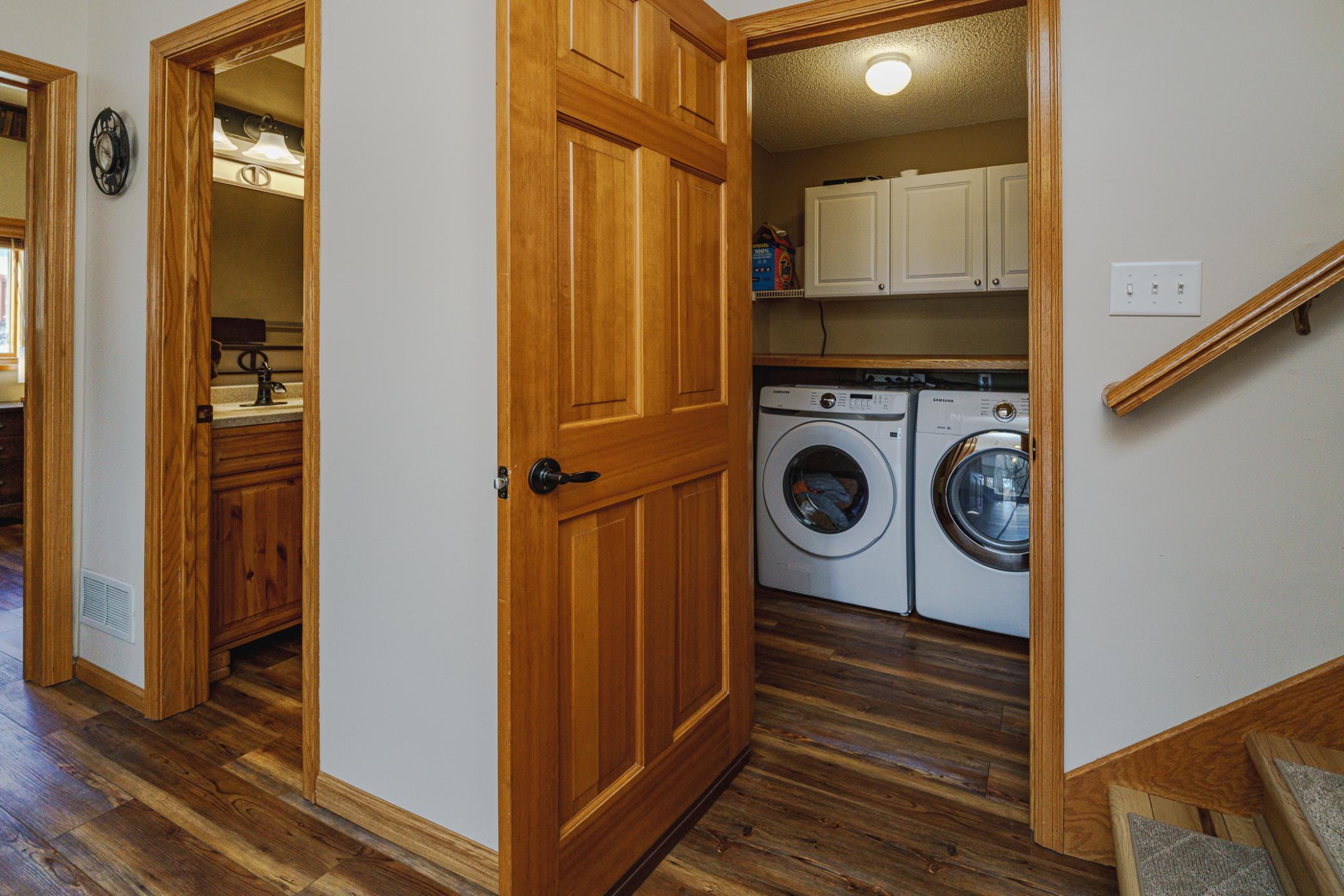 The laundry on this level includes a new washing machine as of March 2026. The lower level 3/4 bath has an elevated height vanity and a shower with tile surround.