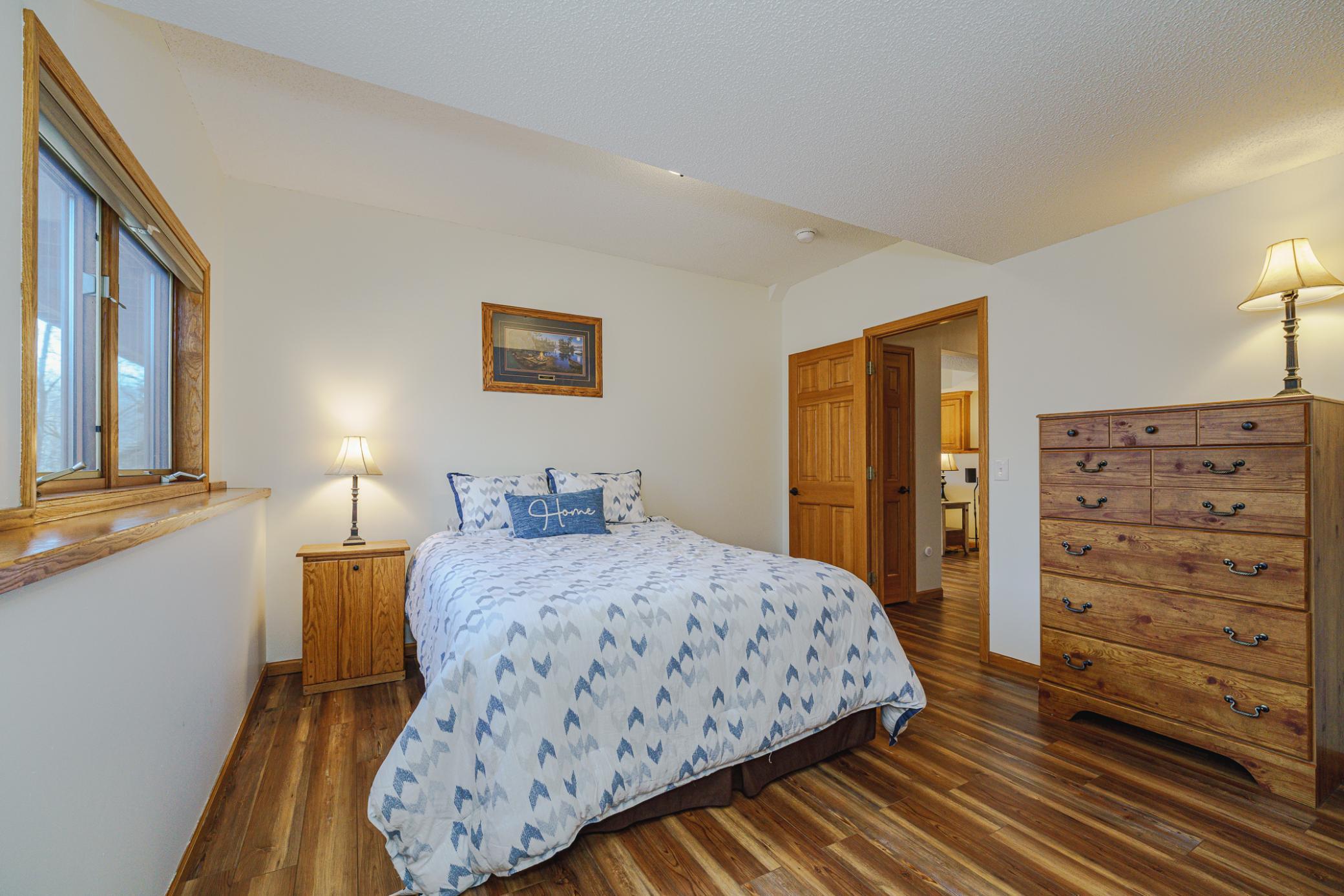 These two large bedrooms have daylight windows. Both bedrooms overlook the tranquil wooded yard.