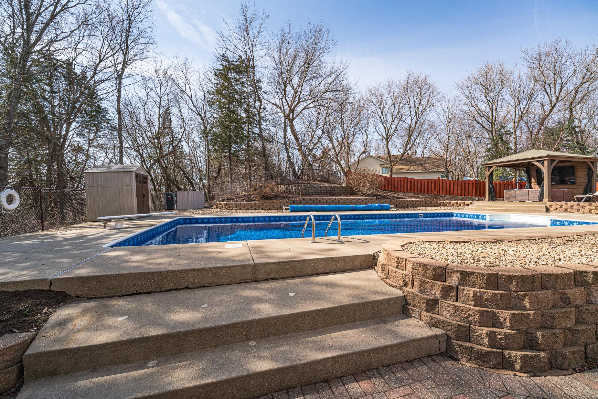 The pool deck can be accessed from the patio via these stairs.