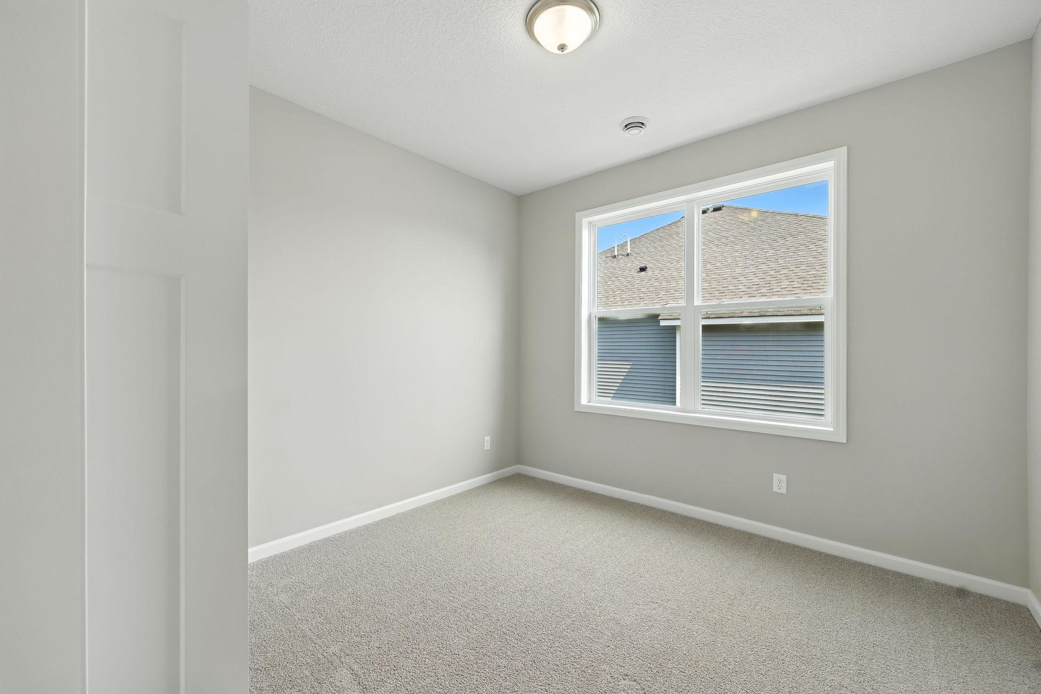 Bedroom #2 *Photo of a previously built home of the same floor plan. Finishes/options may vary.